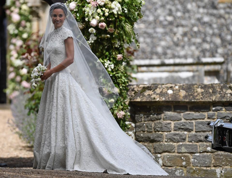  Pippa Middleton dazzled in the stunning bespoke ivory lace gown, which was created by British fashion designer Giles Deacon