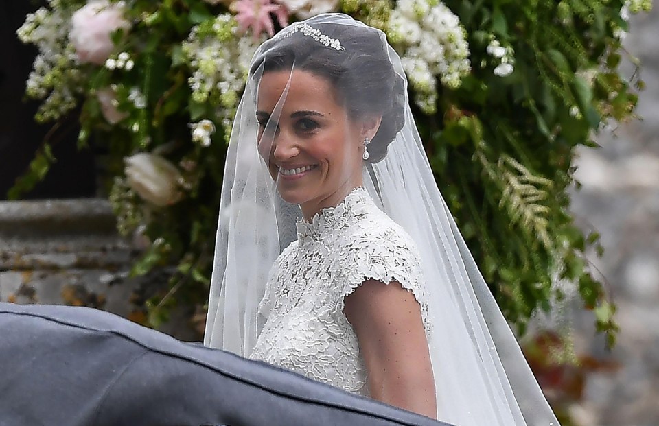 Pippa teamed her striking dress with was teamed with a Stephen Jones veil, a Maidenhair Fern tiara and Manolo Blahnik ivory satin shoes