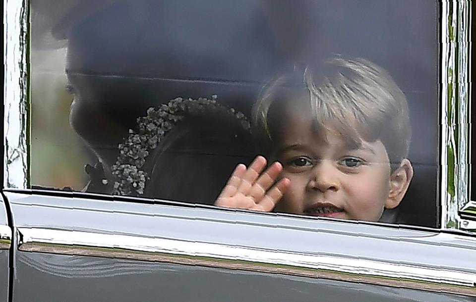  George waves at the window of the car as he leaves the wedding ceremony