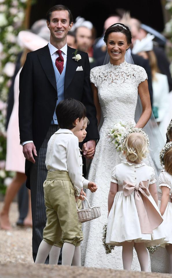  The couple were hand in hand as they were surrounded by youngsters