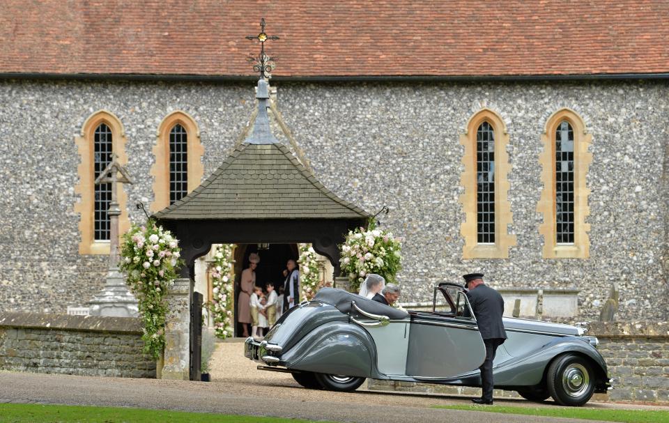  The bride and her father arriving for the service at St Mark’s church in Berkshire