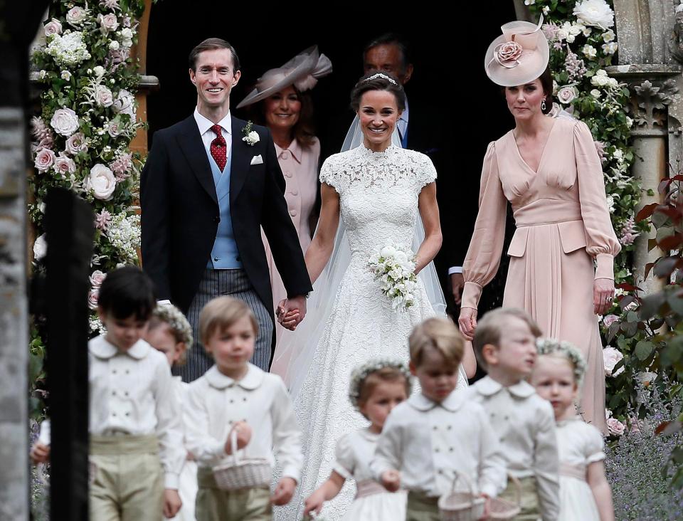  Kate Middleton joins newly weds James and Pippa as they stroll out of church a married couple