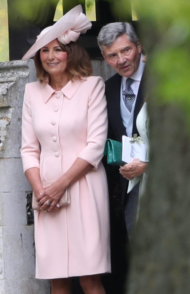  The parents of the bride, Carole and Michael Middleton, wait for their daughter to arrive