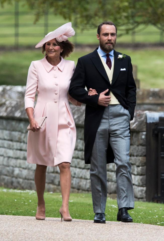  Carole Middleton arm-in-arm with her son James on the way to Pippa's wedding