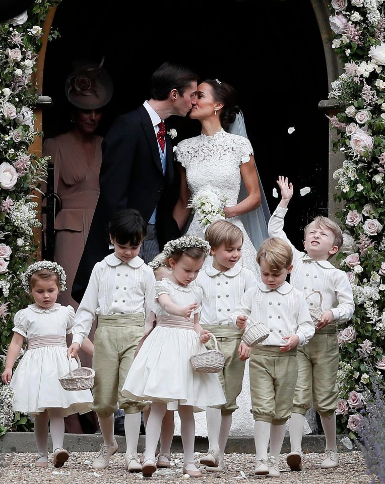 Pippa Middleton and James Matthews enjoy their first kiss as husband and wife as Prince George leads the page boys and bridesmaids out of St Mark’s Church