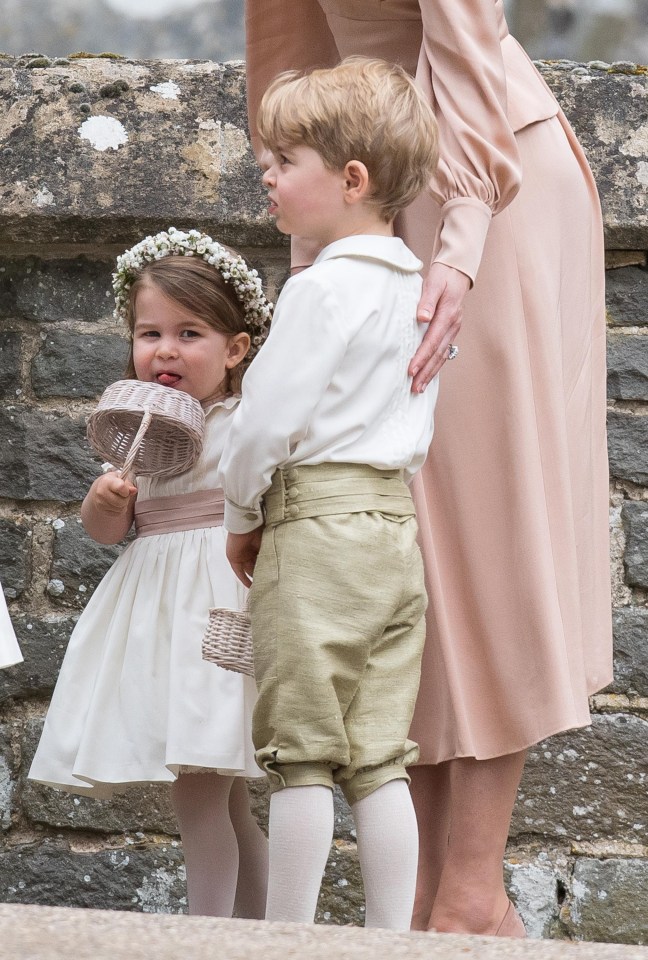 Princess Charlotte and Prince George look ready to head to the reception as they wait for bride and groom outside church