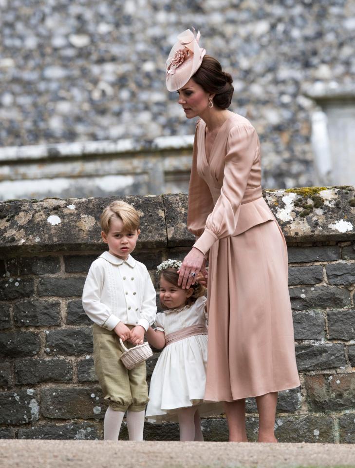  Kate Middleton with Prince George and bridesmaid Princess Charlotte at the wedding