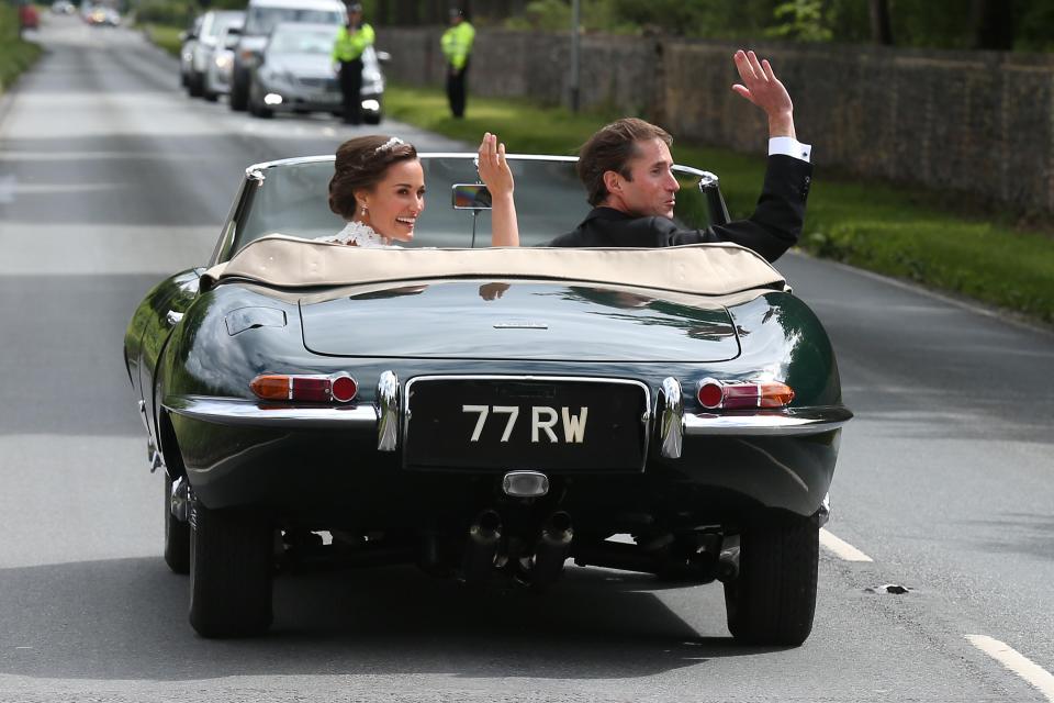  Pippa and James waved at well-wishers as they sped off in a Jaguar V to Englefield House, a 16th century manor in breath-taking grounds