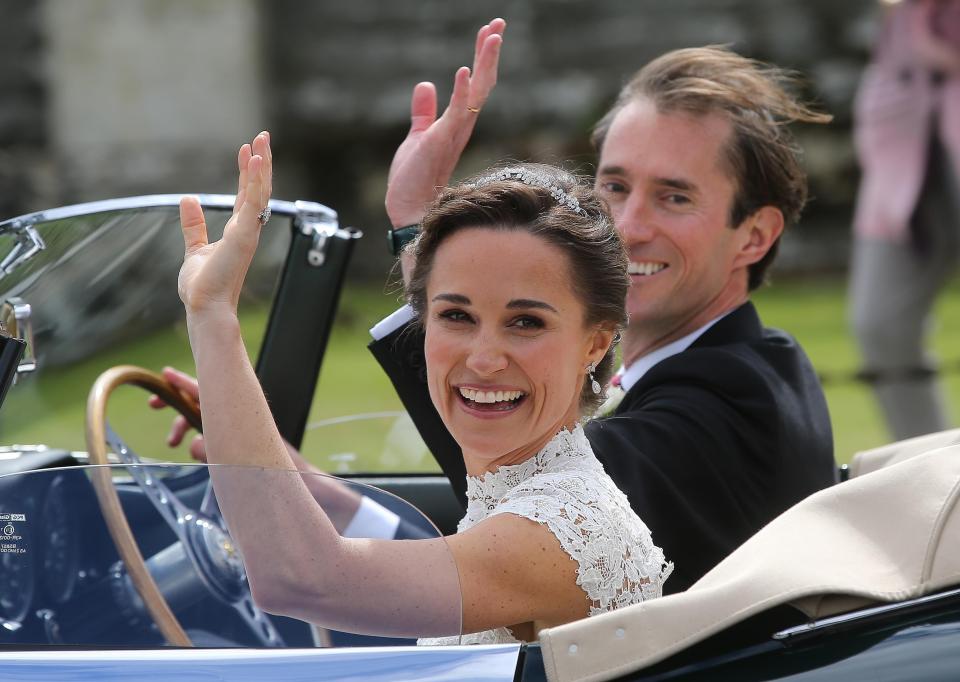  Pippa and her new husband James depart in their vintage convertible car