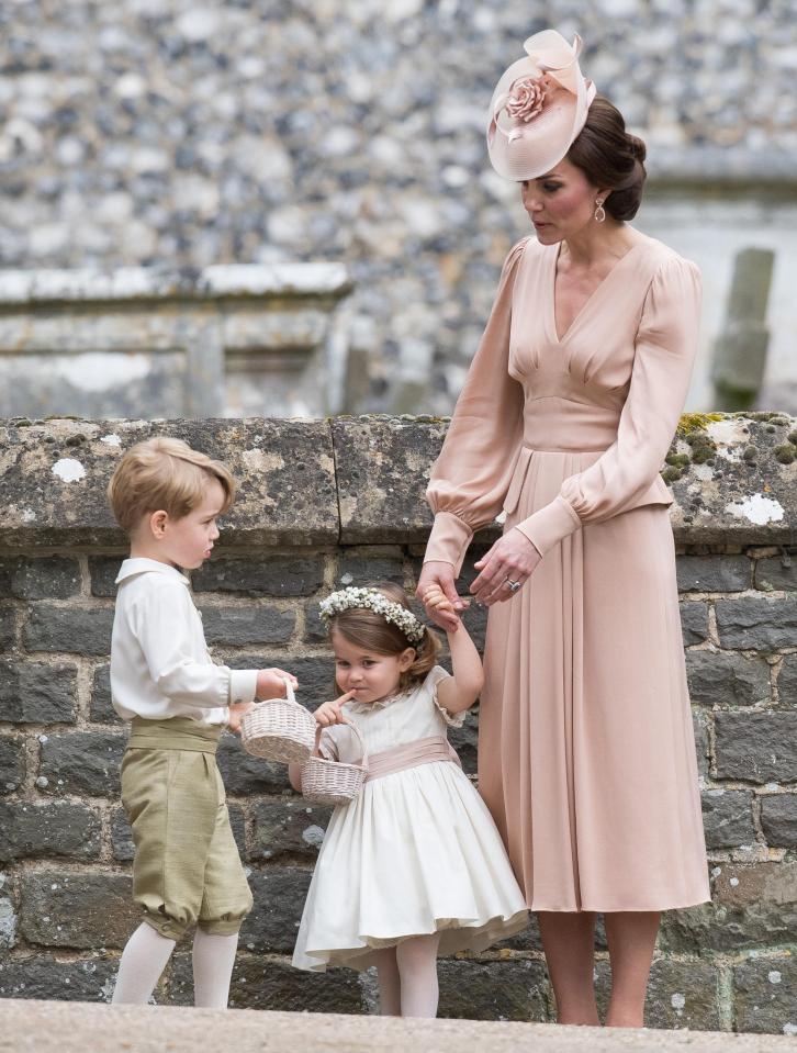  The Duchess of Cambridge with her two children before their ceremonial duties