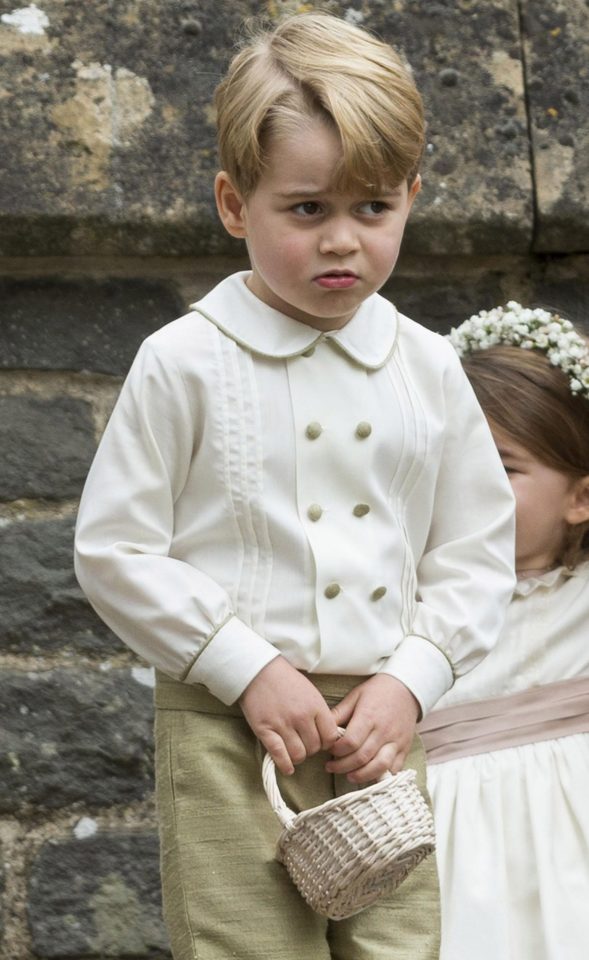  Prince George was spotted looking very unimpressed after receiving a telling off from his mum Kate outside of the church