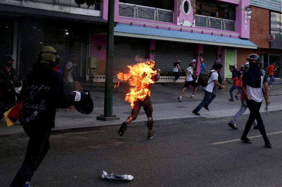  They accused the man of stealing during the rally against President Nicolas Maduro