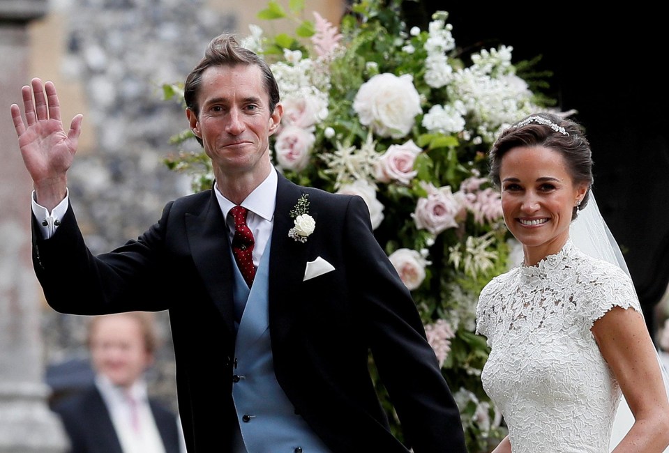 James Matthews waves to well-wishers, while Pippa Middleton smiles in her bespoke Giles Deacon gown, which is reported to have cost £40,000