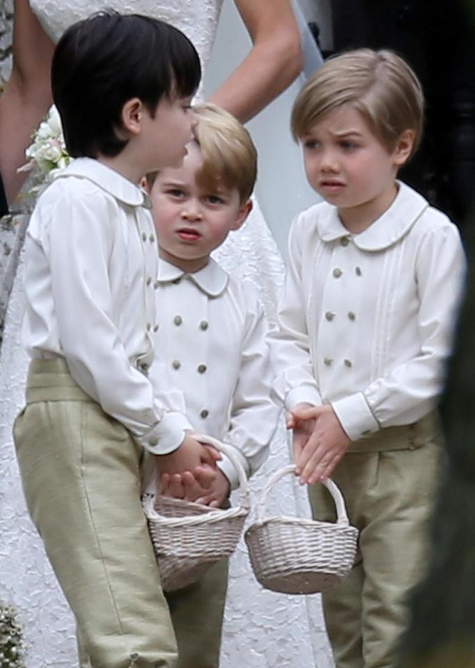  Prince George was seen sulking after getting a telling off from his mum for standing on Pippa's dress