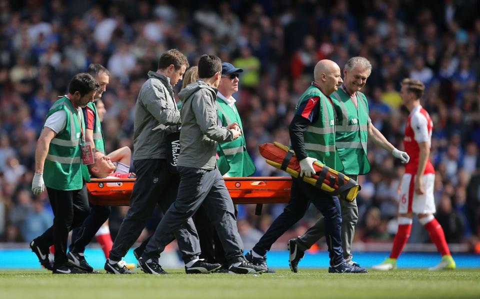  Gabriel Paulista was carried off on a stretcher as Arsenal face a defensive crisis for the FA Cup final