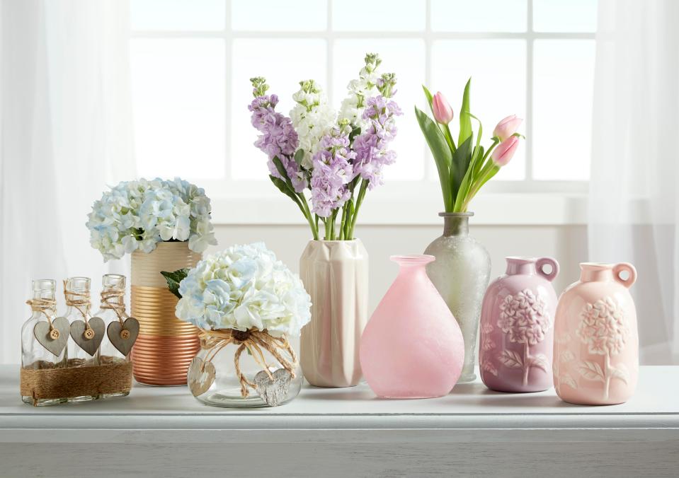  Shoppers can put together their own flower arrangements by placing the faux bouquets into the cute £1 vases