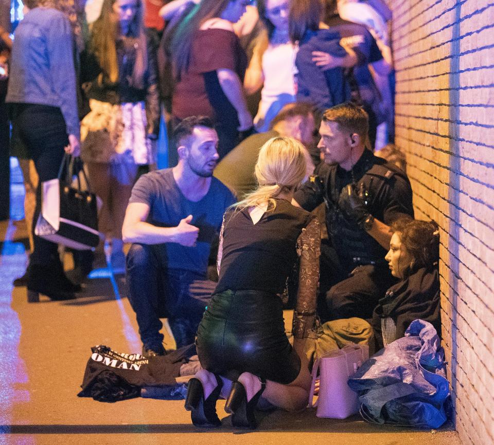  Wounded people huddled on Hunts Bank outside Victoria Station in Manchester