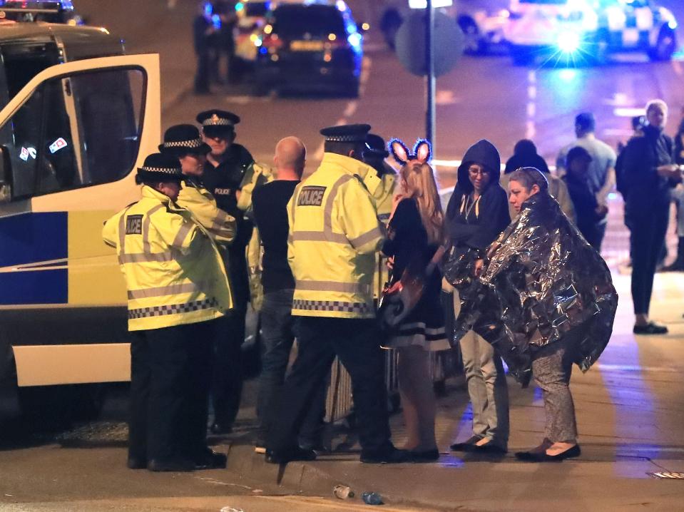  Police comfort concert-goers after the attack in Manchester