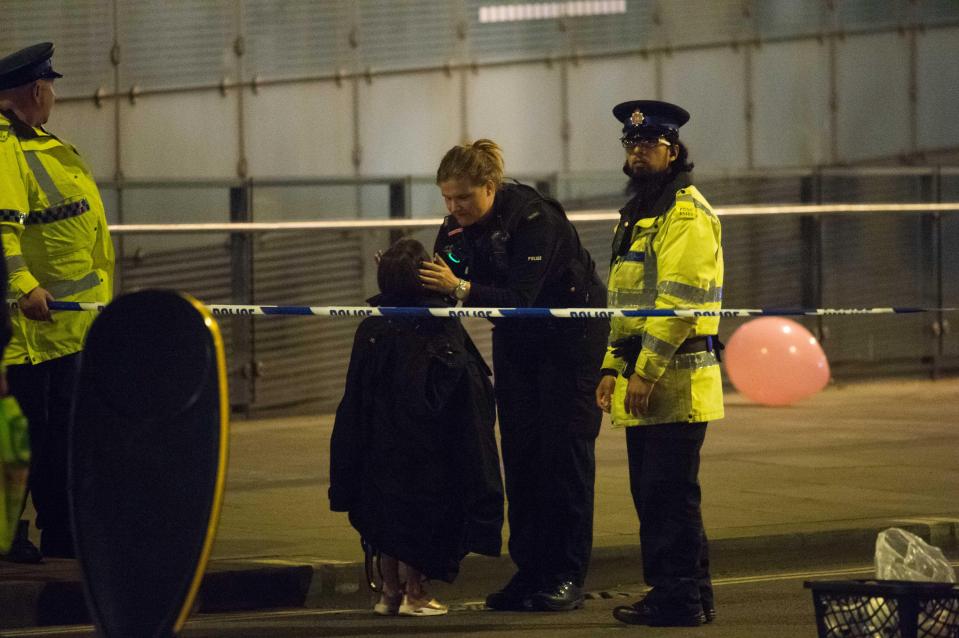 A young girl was wrapped up in a coat to keep warm