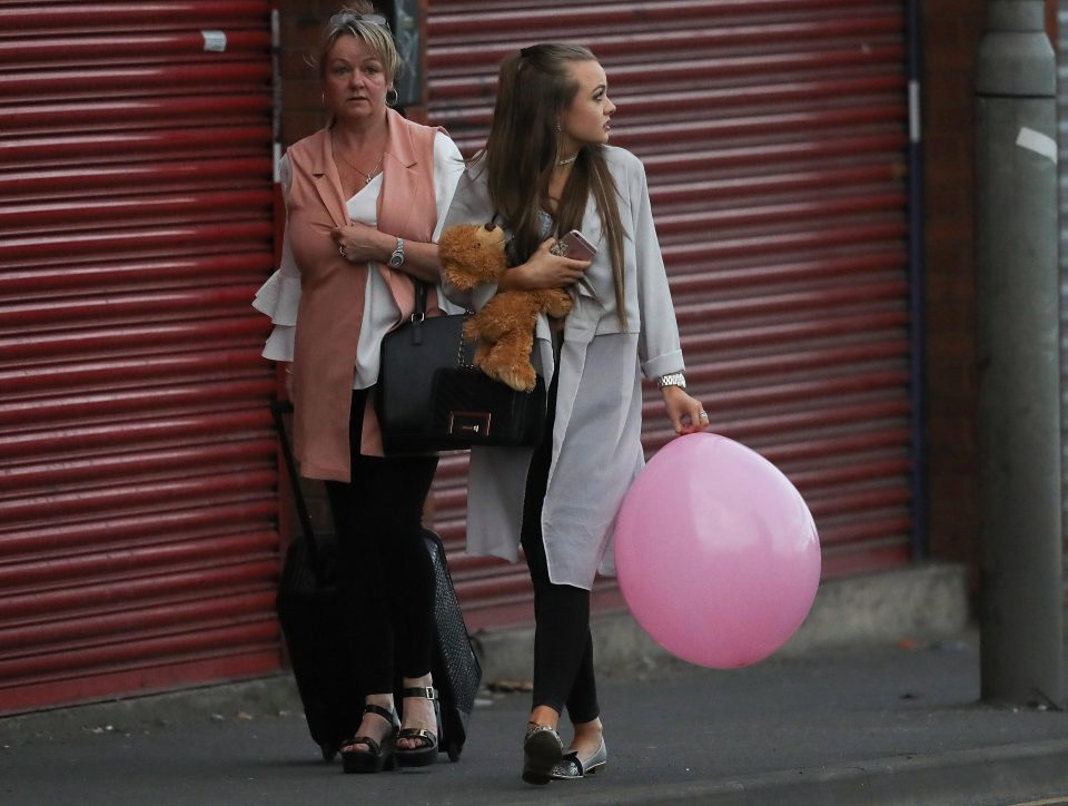  Concert attendees leave the Park Inn where they were given refuge after last night's explosion