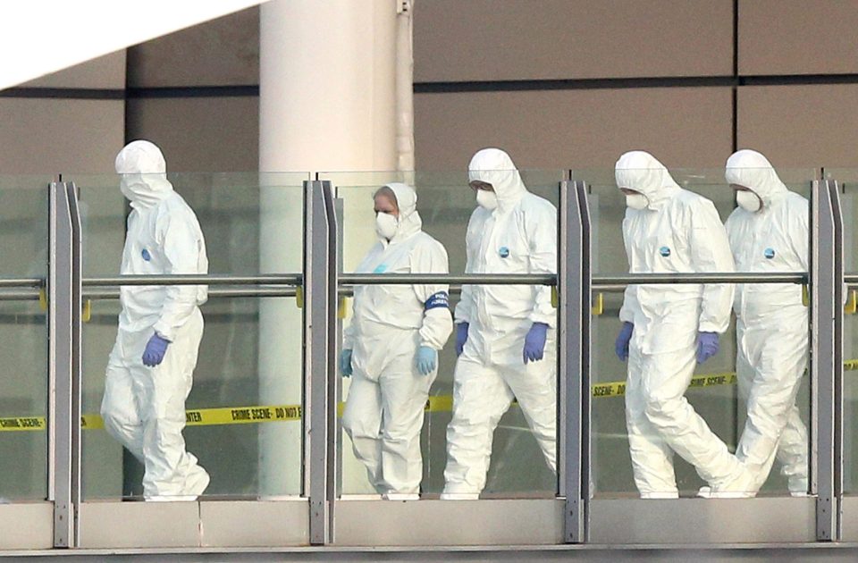  Forensic teams search the bomb site for clues this morning