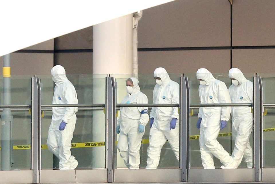  Forensic officers leave Manchester Arena after investigating the scene of an explosion