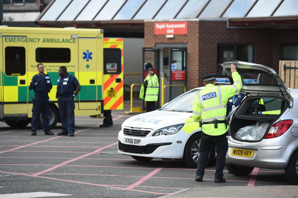 Ambulance staff and police outside Manchester Royal Infirmary this morning