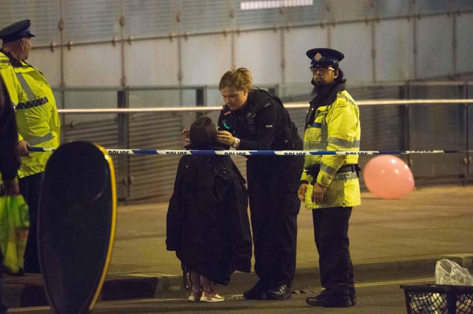  Comfort . . . a police officer reassures a youngster