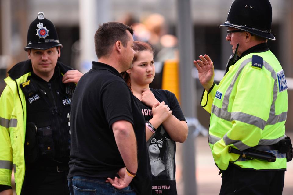 Police talk to members of the public in the aftermath of the Manchester bombing