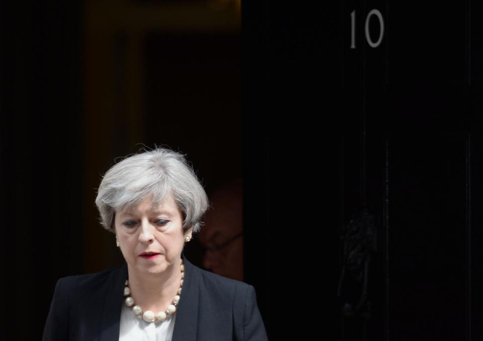  The PM looked solemn as she stepped outside - but encouraged Brits to remember the spirit of those who helped