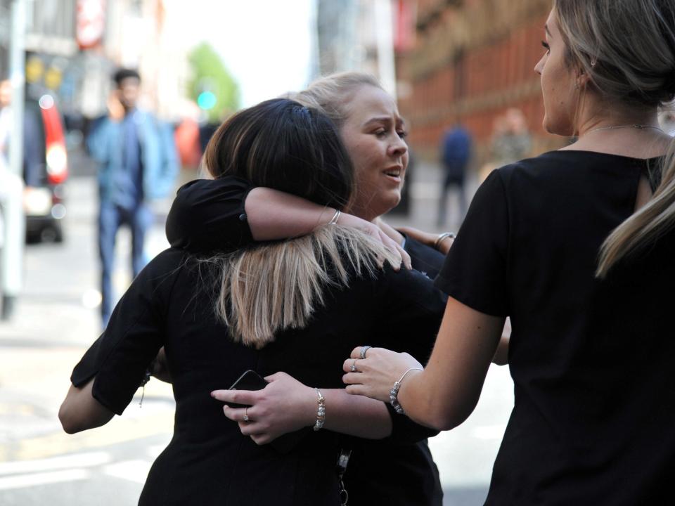 People hugged each other outside the centre just hours after last night's terror atatck