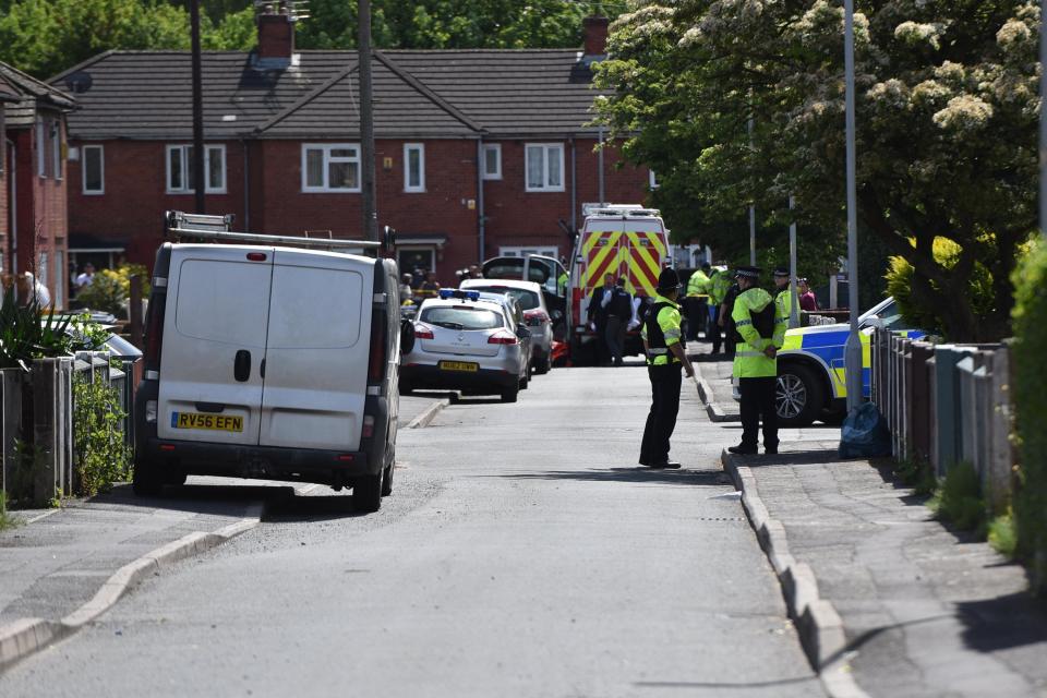 Police are seen in Chorlton, Manchester where a man was arrested