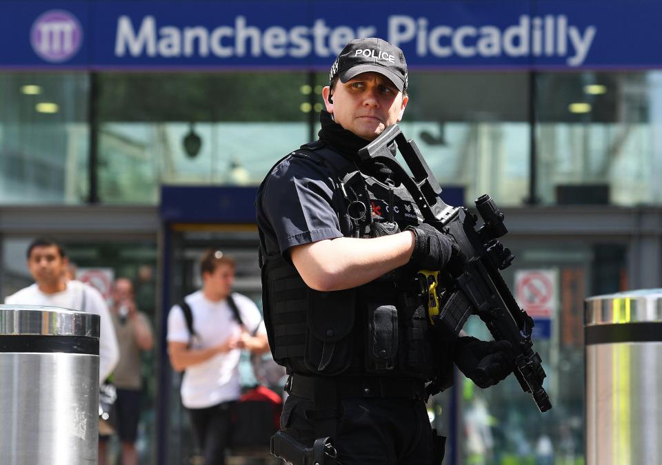 Armed police were positioned around Manchester today 