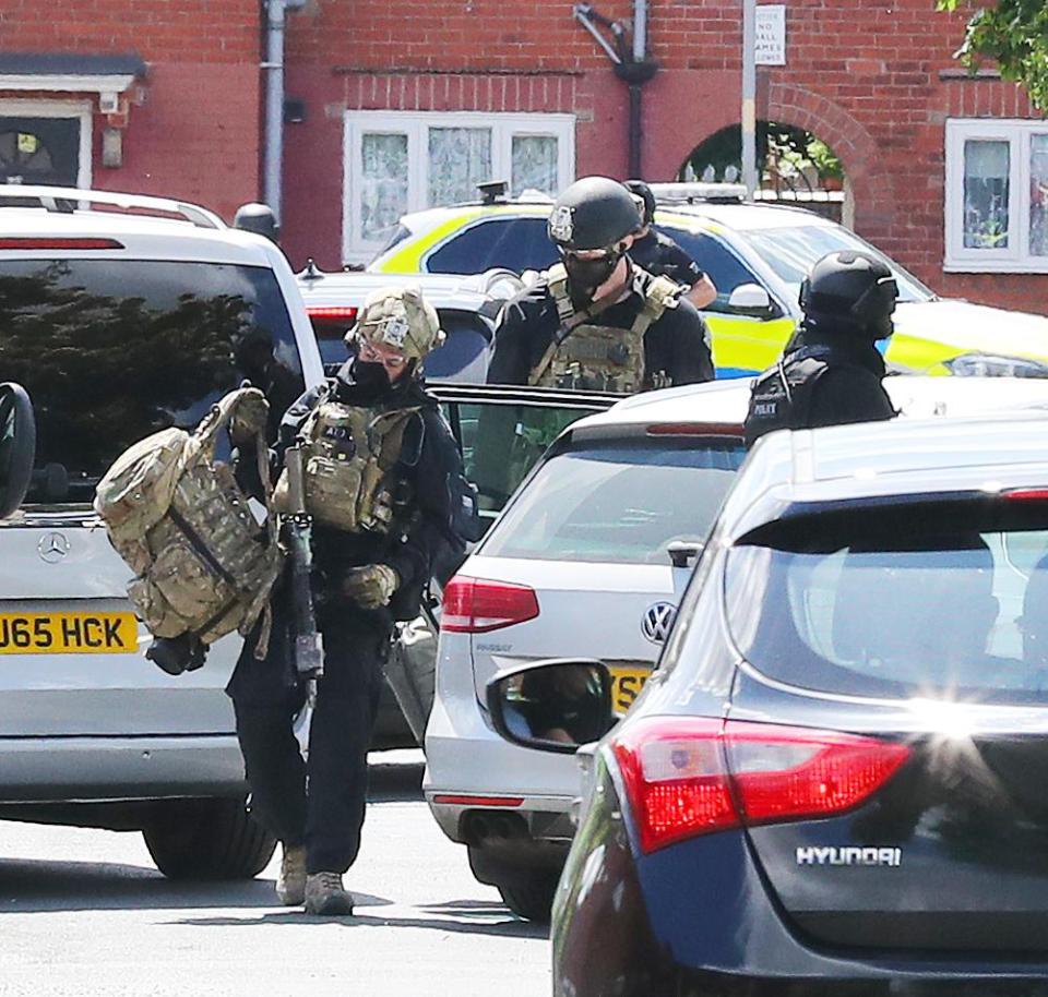 Police raid a house on Elsmore Rd in Fallowfield, South Manchester in connection with last night's bomb