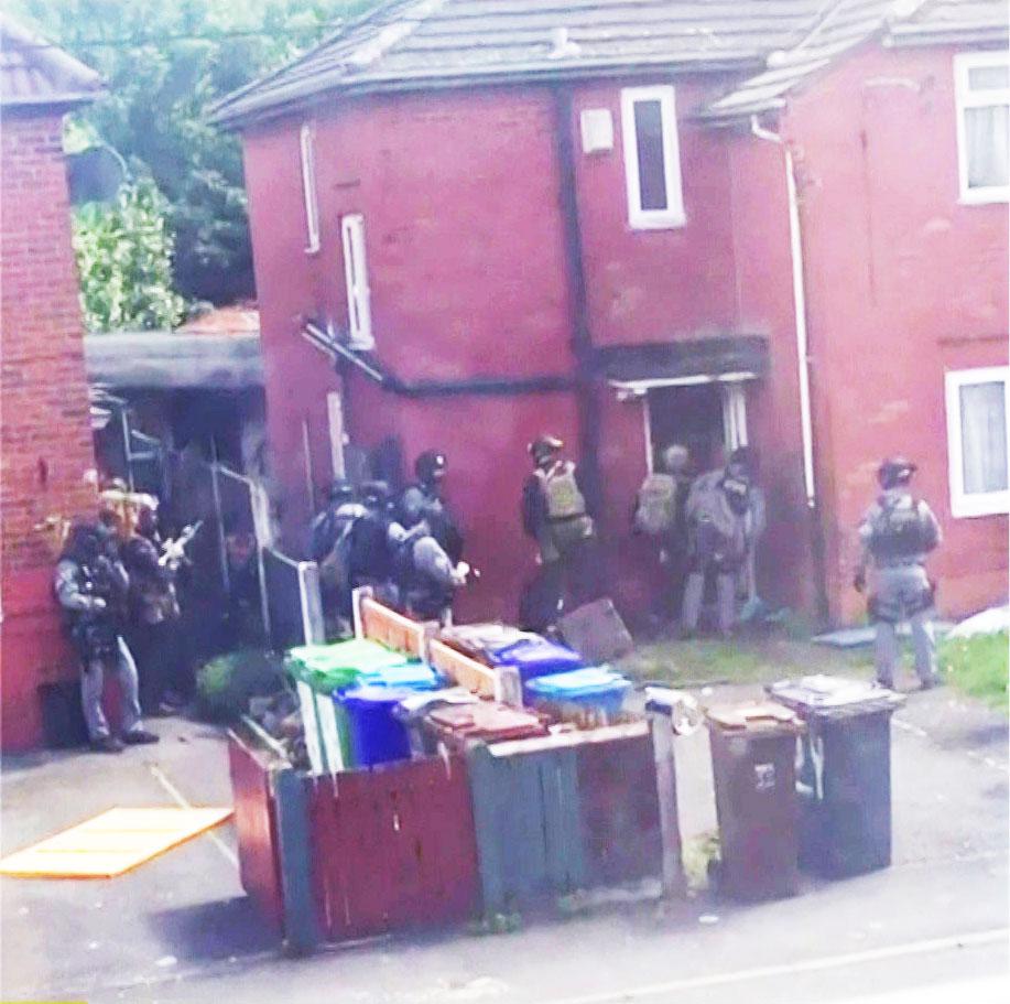 Armed cops surround Manchester-born Abedis house – just four miles from the scene of the bombing