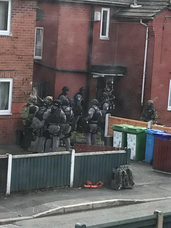  Dramatic moment cops raided the suicide bomber's home in the Fallowfield area of Manchester