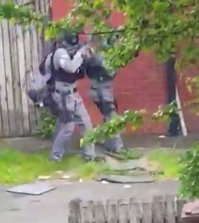 Dramatic footage showed two heavily armed terror cops raiding a home