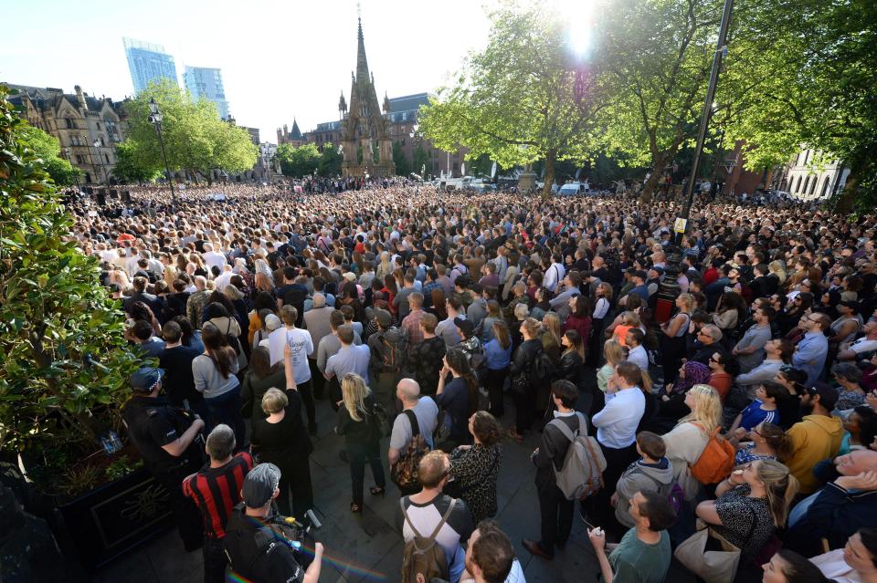  People gather for a vigil in Albert Square outside Manchester Town Hall