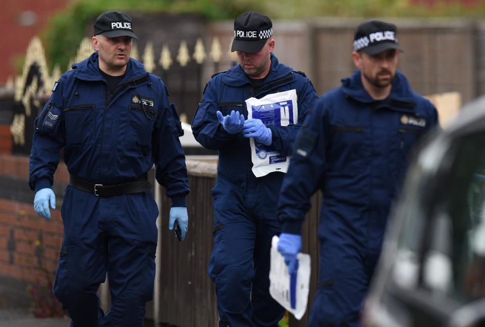  Police officers arrive at the home on Elsmore Road in Fallowfield, Manchester this morning