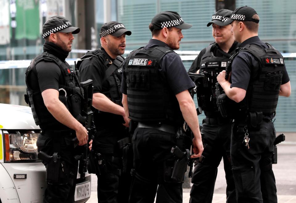  Armed police keep guard near Victoria Station in Manchester this morning in the wake of the bombing on Monday night