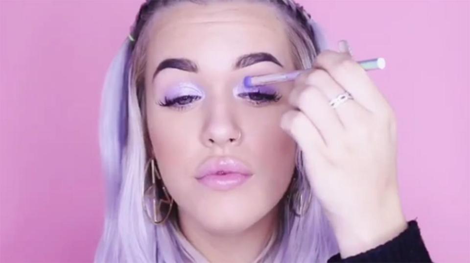  Lottie began the tutorial by applying a lilac shadow to her lids, followed by a silver glitter