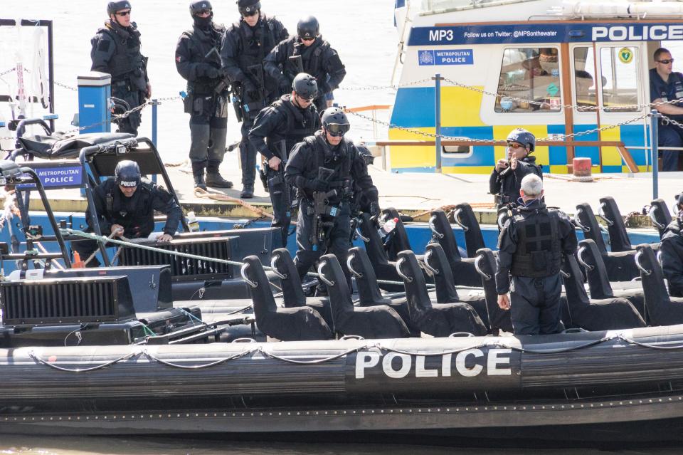  Armed marine officers pictured getting into a boat this morning as cops numbers are increased