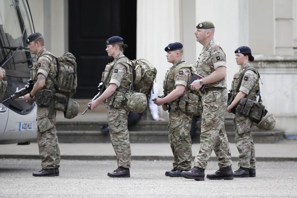  Soldiers pictured lining up at Wellington barracks as they are deployed to join armed cops