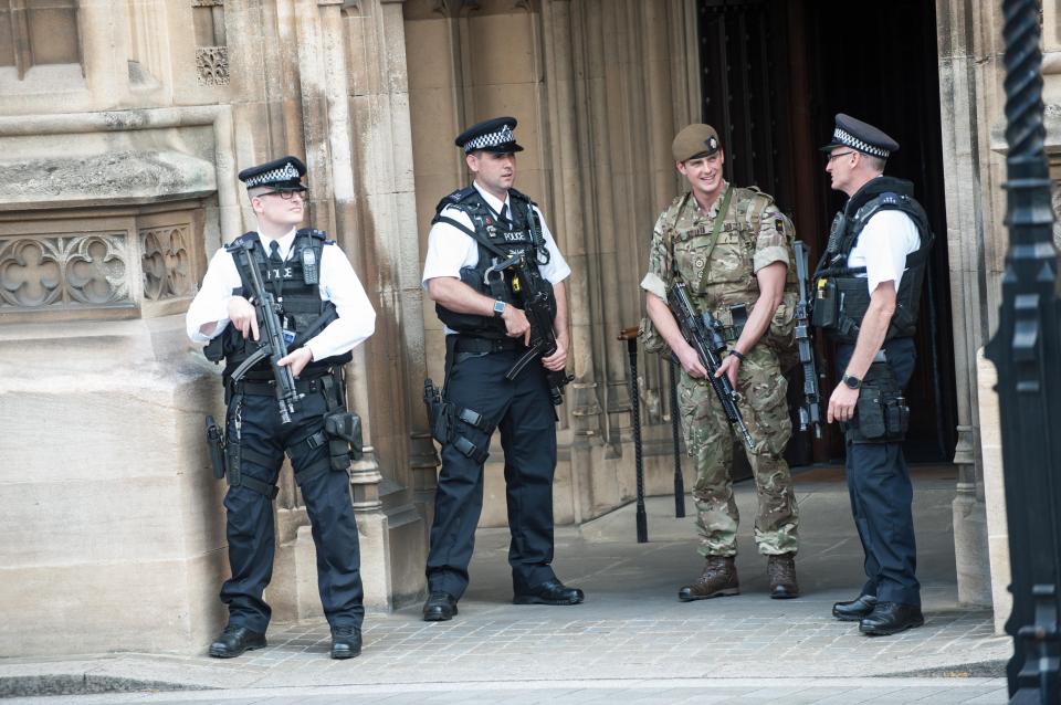  Soldiers join armed police guarding Parliament yesterday