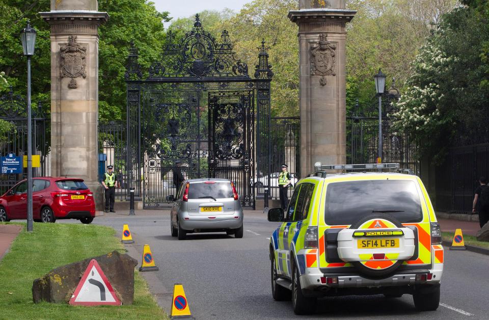  Police presence has been increased throughout the UK following the terror attack - pictured here is the Palace of Holyroodhouse in Edinburgh