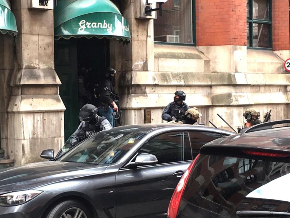  Police have raided a block of flats close to Manchester Piccadilly Station following Monday's attack in the city