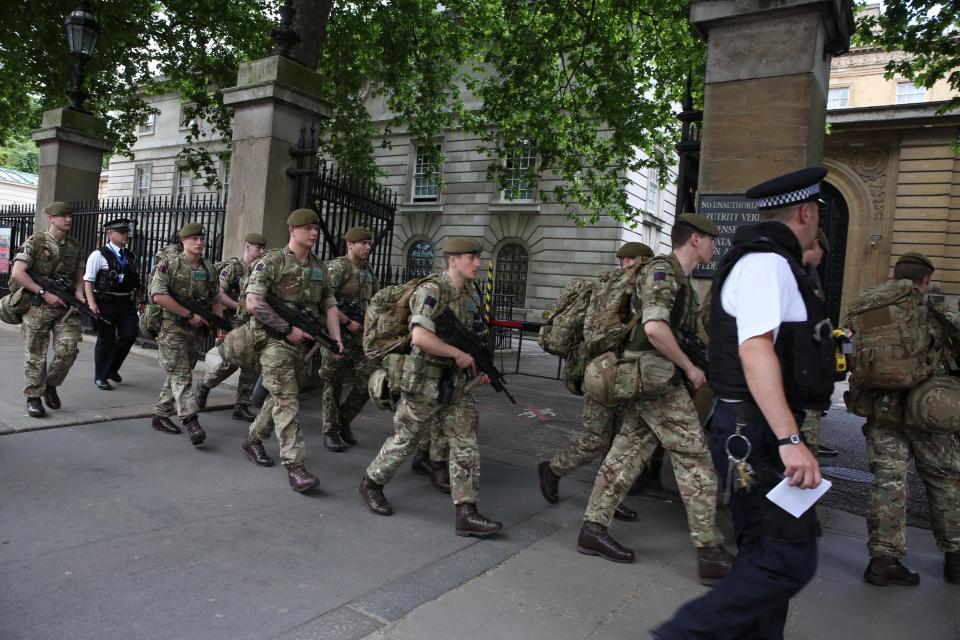  Lines of soldiers pictured here marching into Buckingham Palace after the terror level for the UK was raised