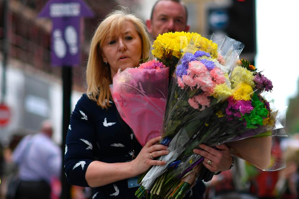  The city centre has been filled with floral tributes following yesterday's candlelit vigil