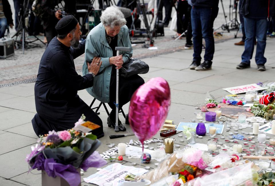  Sadiq comforts Renee in an emotional scene at the tribute, where candles, balloons and flowers have been left