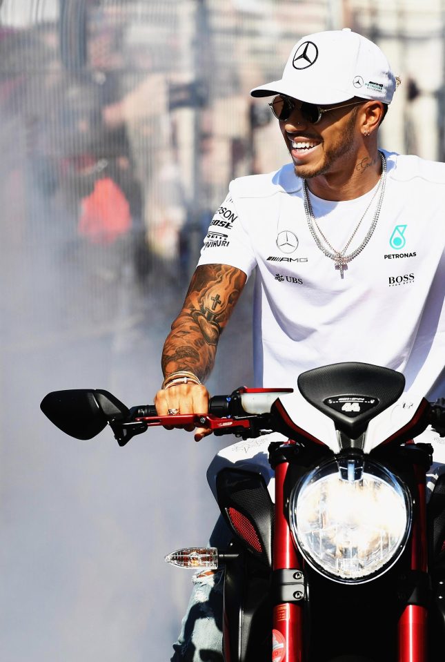  Lewis Hamilton on his motorbike in the paddock at Monaco